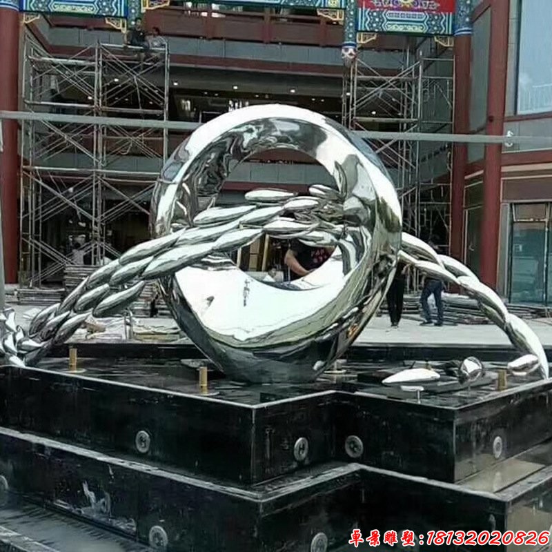 不锈钢镜面鱼群跃圆环雕塑